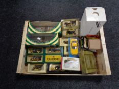 A crate of boxed die cast vehicles,