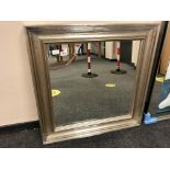 A silvered framed mirror