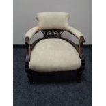 A Victorian mahogany armchair in cream floral fabric