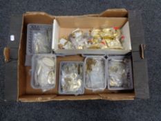 A box of brass door furniture and fixings