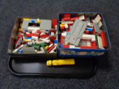 A tray of two tins of vintage lego,