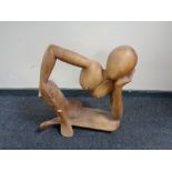 A teak abstract sculpture - female nude