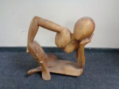 A teak abstract sculpture - female nude