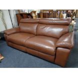 A brown leather reclining settee