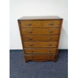 A mid century oak six drawer chest