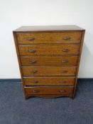 A mid century oak six drawer chest