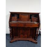 A reproduction mahogany desk