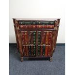 A double door bookcase fitted with two drawers with faux book front