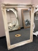 An ivory style swept frame mirror