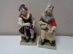 A pair of antique Staffordshire glazed pottery figures a/f