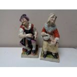 A pair of antique Staffordshire glazed pottery figures a/f