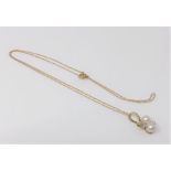 A 10ct gold diamond and pearl pendant on chain