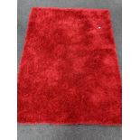 A contemporary red rug