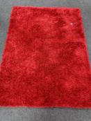 A contemporary red rug