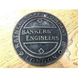 A cast metal circular safe-maker's plate : Bankers' Engineers, 21 cm.