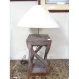 A hardwood table lamp with shade