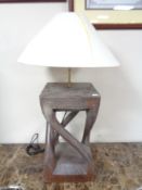 A hardwood table lamp with shade