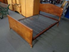 A 1930's walnut 4'6" bed frame with Vono box spring CONDITION REPORT: Width 140 cm,
