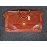 A vintage leather Henry valise together with three other leather cases and bags