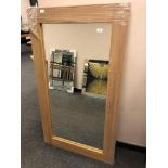 An oak effect flat framed mirror