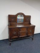 An Edwardian oak mirror backed sideboard 137 cm x 46 cm x 146 cm (h).