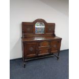 An Edwardian oak mirror backed sideboard 137 cm x 46 cm x 146 cm (h).