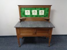 An Edwardian oak Art Nouveau marble topped tiled back wash stand CONDITION REPORT: