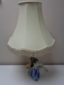 A Nao figural table lamp with shade - Girl with bird in hand