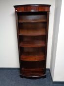 A contemporary mahogany bow-fronted set of bookshelves