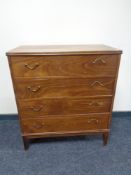 A mid century continental four drawer chest