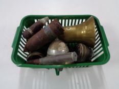 A basket of antique shell and bullet casings