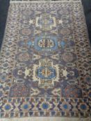 A Caucasian rug on blue ground,