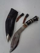 A Kukri knife in scabbard