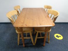 A pine kitchen table and four chairs