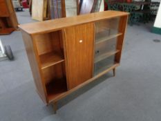 A mid century teak sliding door bookcase CONDITION REPORT: 199 cm x 27.5 cm x 83.