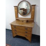 An Edwardian oak Art Nouveau dressing chest
