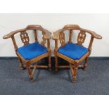 A pair of early 20th century oak corner chairs
