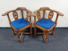 A pair of early 20th century oak corner chairs