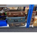 Four mid century luggage cases