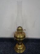 A vintage brass Duplex oil lamp with glass chimney