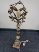 An early twentieth century pot metal table lamp on marble base and raised feet