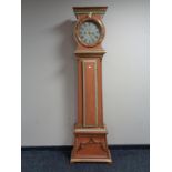 An antique continental painted longcase clock by J.C.