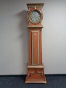 An antique continental painted longcase clock by J.C.