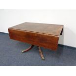 A Victorian mahogany pedestal pembroke table