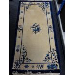 A blue fringed Chinese rug,