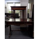 A reproduction mahogany sofa table and a nest of three tables