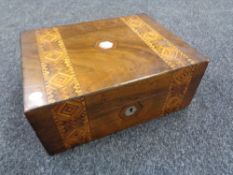 A Victorian inlaid walnut sewing box containing sewing items and thread