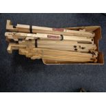 A box of four folding wooden easels