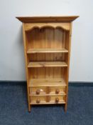 A small pine wall shelf fitted four drawers CONDITION REPORT: 39.5 cm x 17 cm x 90.