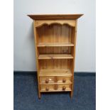 A small pine wall shelf fitted four drawers CONDITION REPORT: 39.5 cm x 17 cm x 90.